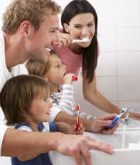 family brushing teeth home care